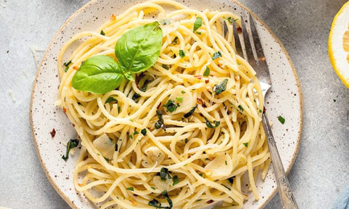 Garlic Herb Pasta served hot in a wide-rimmed porcelain bowl