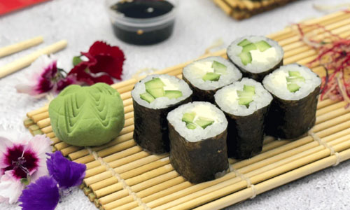 Cucumber Sushi Plate Classic arranged on a dark stone platter